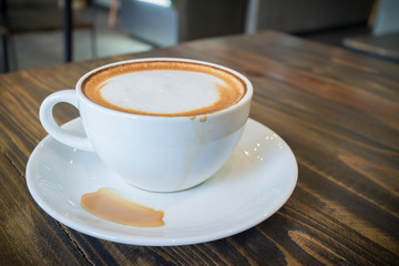 hot coffee mocha with foam milk in vintage cafe