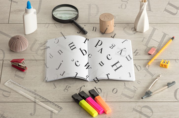 Open notebook with letters on it