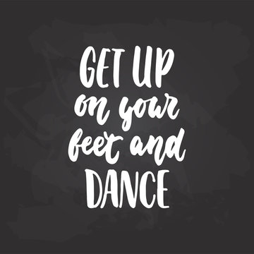 Get up on your feet and dance - lettering dancing calligraphy quote drawn by ink in white color on the black chalkboard background. Fun hand drawn lettering inscription.
