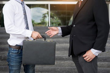 Two confident business partners discussing workflow plan talking and working together