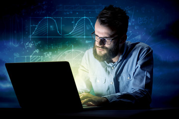 Businessman in the office at night
