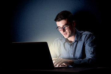 Businessman in the office at night