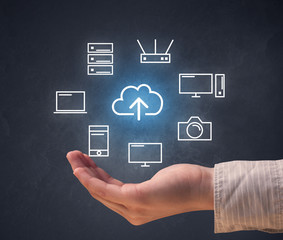 Hand holding technology related icons