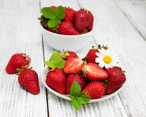 ripe strawberries on wooden table