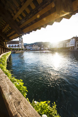 TOP OFF ATTRACTION IN SWITZERLAND. LUCERNE OLD WOOD CHAPEL BRIDGE IN SUMMER SUNSET LIGHT