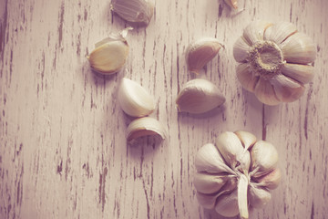 Fresh garlic on rustic wood and bokeh background