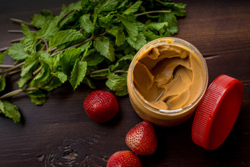 Peanut Butter on Wooden Table