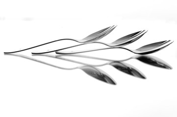 Fototapeta na wymiar spoon reflection on white background, reflection art