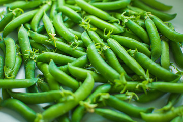 Fresh pea pods and peas closeup, macro