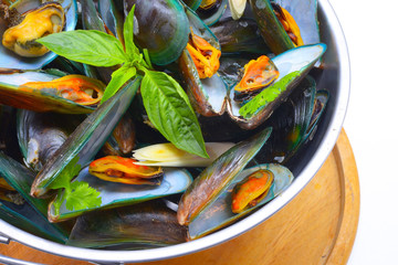 Thai Food steamed mussels with basil and lemongrass. Eaten with spicy sauce.