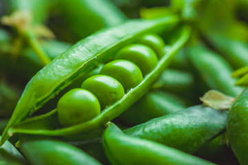 Fresh pea pods and peas closeup, macro