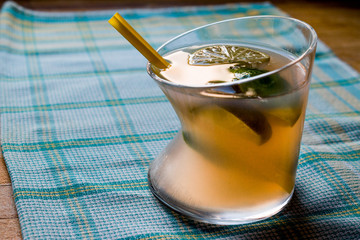 Paloma Cocktail with lime and yellow straw.