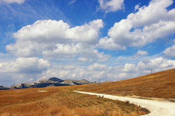 Landscape with a mountain country road. Balkans. Montenegro, Krnovo, near Niksic town