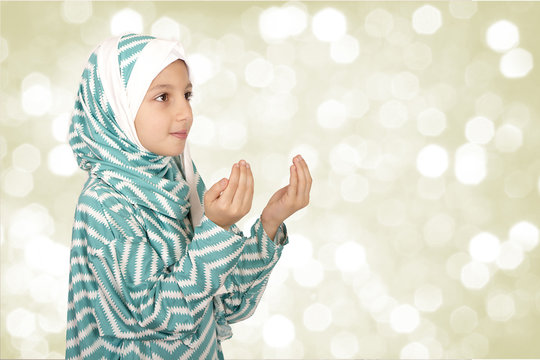 Cute Little Muslim Girl wearing hijab - making duaa ( praying to Allah )