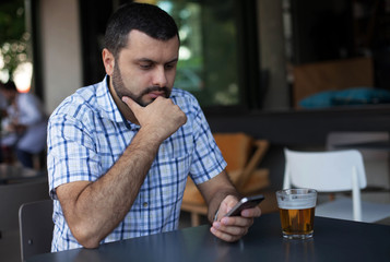 Handsome man using phone