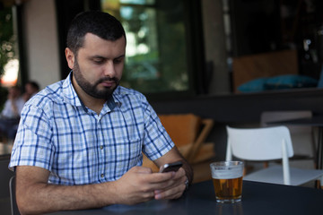 Handsome man using phone