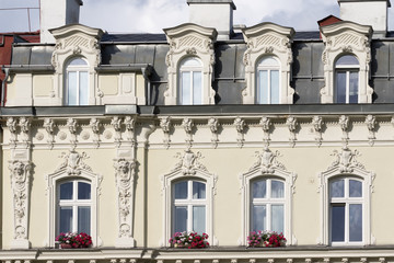 Obraz premium Karlovy Vary, Czech Republic - August 15, 2017:old condominiums flanked by the streets of the city, with a row of windows