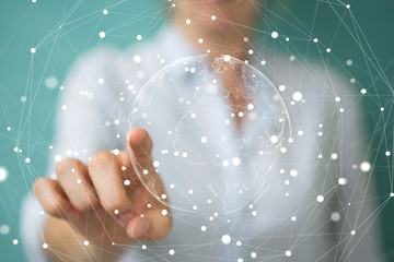 Businesswoman using flying earth network interface 3D rendering