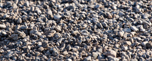 Crushed stone on the road as a background