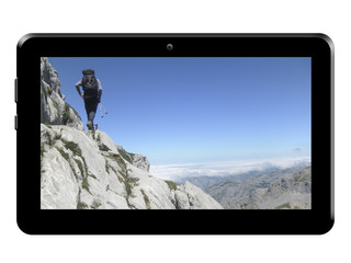 Tablet with hotography of mountains on white background.