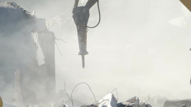 Debris dust is on the air of a construciton site.