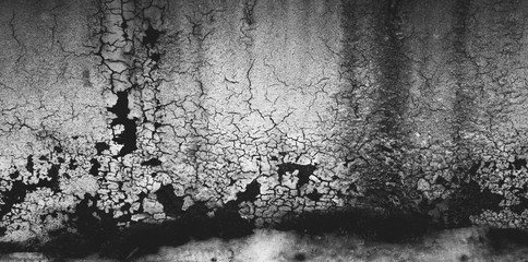 Old Paint Grunge Black and White Damaged Wall with Cracks. Dirty Rough Texture Background 