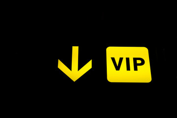 VIP sign arrow on black background