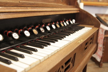 Fototapeta na wymiar old styled and retro vintage harpsichord as background - very low DOF.