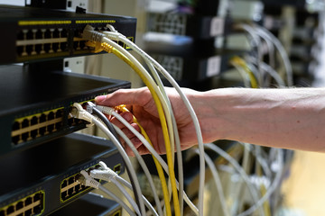 Hand with rj45 cable © molenira