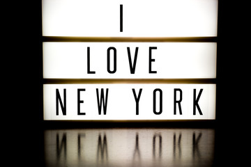A light up board displaying the phrase I LOVE NEW YORK
