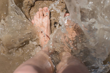Fototapeta premium Feet in the water