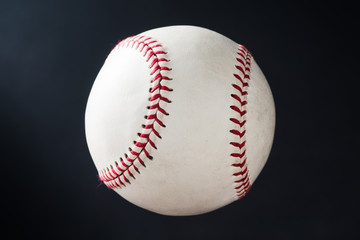 used baseball against dark shade background