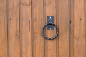 wooden gate with handle and keyhole