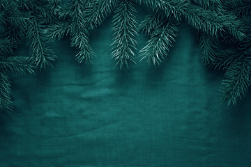 Merry Christmas and Happy New Year greeting background with fir tree branches. Space for copy. Top view. 