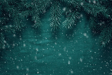 Merry Christmas and Happy New Year greeting background with fir tree branches. Space for copy. Top view.