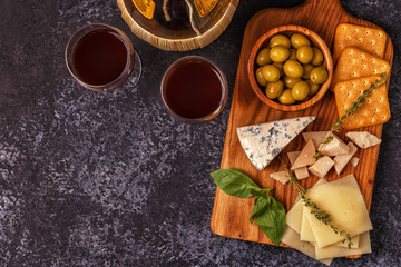 Cheese cracker olives wine.