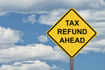 Caution Sign Blue Sky - Tax Refund Ahead