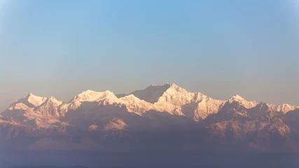 Papier Peint photo Kangchenjunga Close-up Kangchenjunga mountain in the morning with blue and orange sky that view from The Tiger Hill in winter at Tiger Hill, Darjeeling. India.