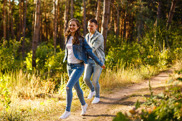 Obraz premium Young couple running at the nature.Summer day jogging.