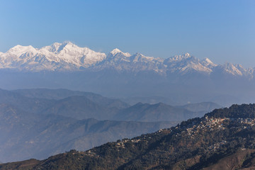 Kangchenjunga mountain in the morning with blue and orange sky and mountain villages that view from The Tiger Hill in winter at Tiger Hill, Darjeeling. India.