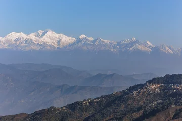 Türaufkleber Kangchenjunga mountain in the morning with blue and orange sky and mountain villages that view from The Tiger Hill in winter at Tiger Hill, Darjeeling. India. © artitwpd