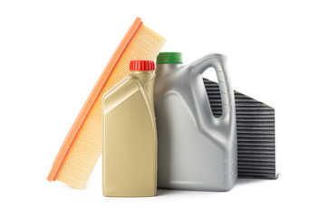 Car oil filters and motor oil can isolated on white