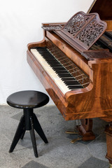 Empty chair beside to the piano.