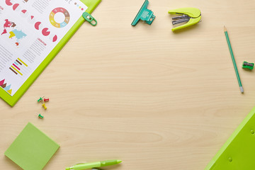 Modern office desk table with green stationery