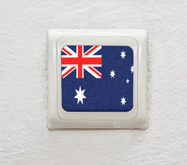 white switch on a white wall with Australian flag