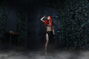beautiful redhead woman warrior near the dark gothic huge gates