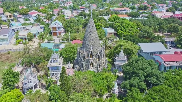 Aerial View Coral Buddhist Temple among Resort City