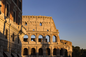 Obraz premium Part of the wall of Colosseum (Coliseum) in Rome, Italy at sunset 