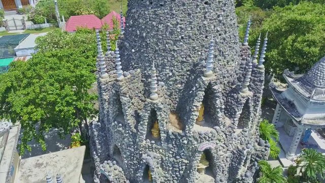 Drone Moves Closely around Buddhist Temple Coral Tower