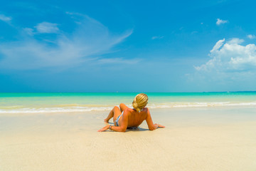 Fototapeta na wymiar Woman on a beautiful beach